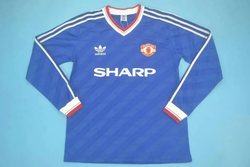 MAILLOT RETRO MANCHESTER UNITED EXTÉRIEUR 1986/1988 VERSION MANCHES LONGUES - MODAFOOT