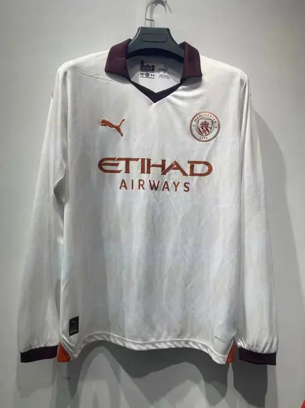 MAILLOT MANCHESTER CITY EXTÉRIEUR 2023/2024 VERSION MANCHES LONGUES - MODAFOOT